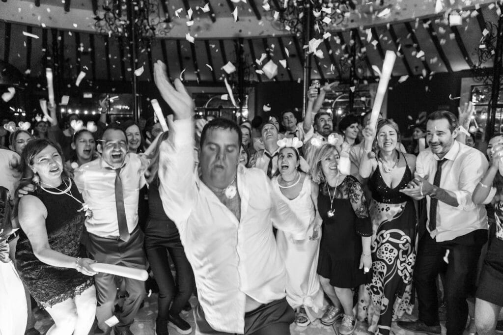 Lively wedding dance party in Mendoza, Argentina with joyful crowd.